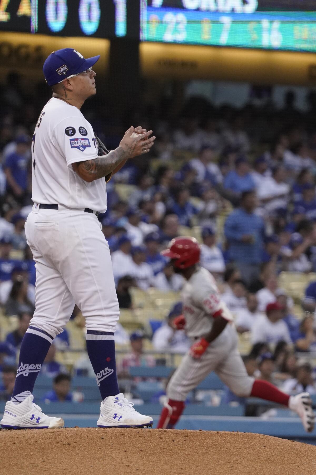 Julio Urías stands on the baseball mound