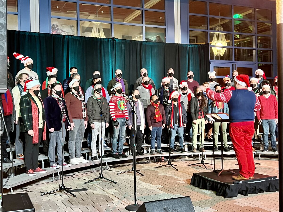 The San Diego Gay Men's Chorus sings holiday songs in La Jolla on Dec. 19. 