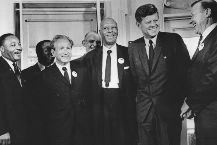 Rabbi Joachim Prinz, second from the left, is joined by, from left, the Rev. Martin Luther King Jr., A. Philip Randolph, President Kennedy and Walter Reuther in this 1963 photo taken in conjunction with the March on Washington.
