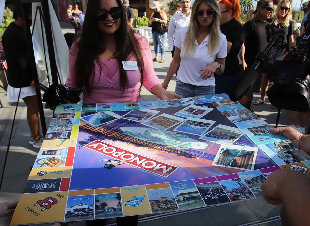 Huntington Beach Mayor Pro Tem Gracey Van Der Mark takes a look at the official "Monopoly: Huntington Beach Edition."
