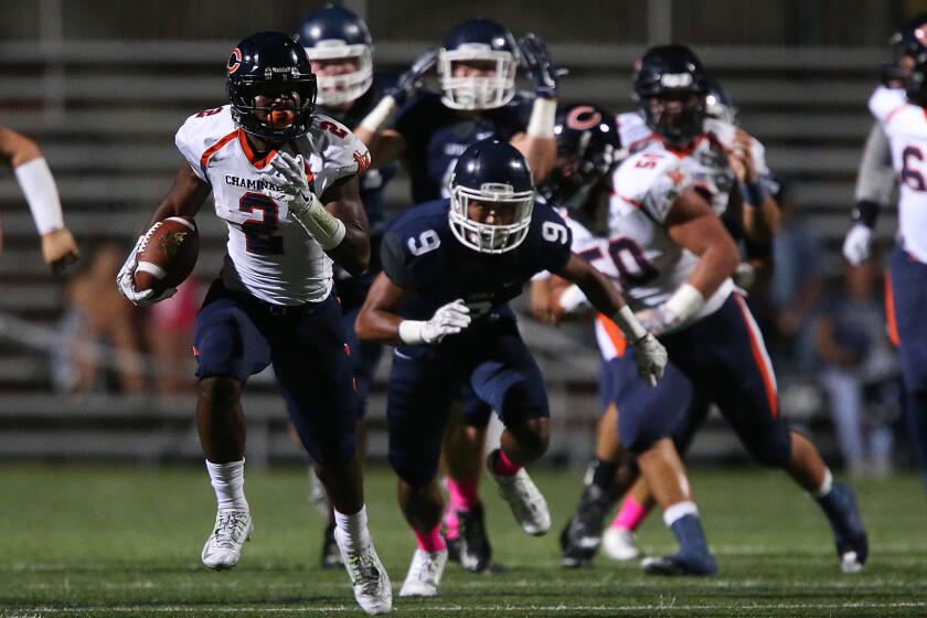 Chaminade running back T.J. Pledger breaks loose for a 73-yard run against Loyola during a game last October.