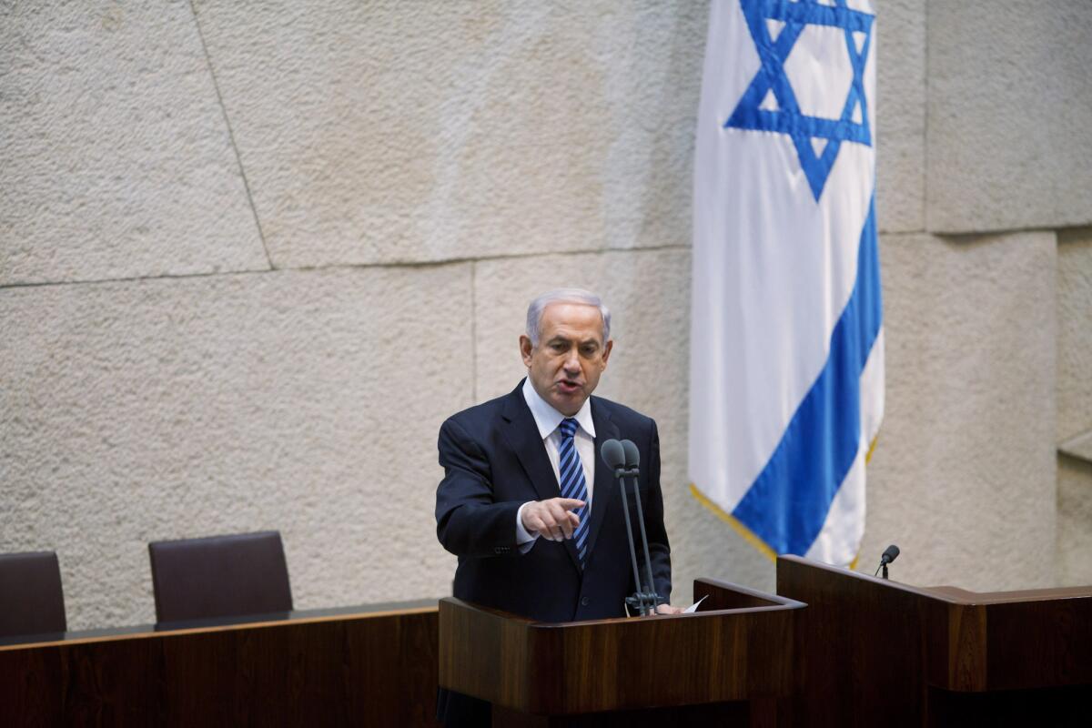 Israeli Prime Minister Benjamin Netanyahu speaks to members of the Knesset on Monday, when Israel's 33rd government was sworn in after almost six weeks of negotiations to piece together a coalition.