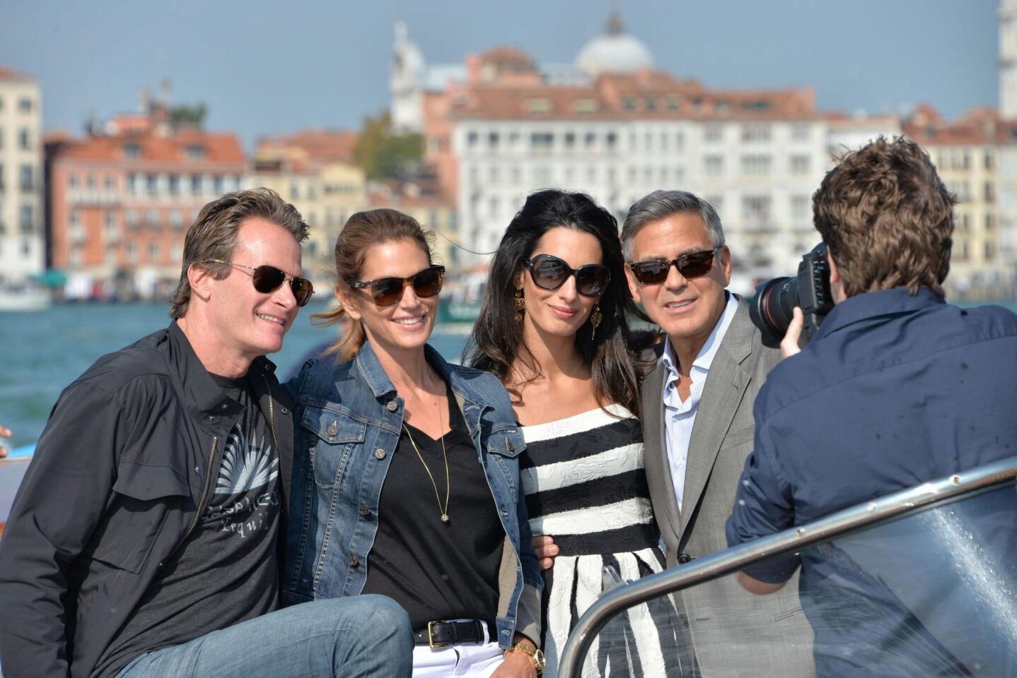 Rande Gerber, left, wife Cindy Crawford, Amal Alamuddin and fiance George Clooney pose for a picture on a water taxi in Venice.