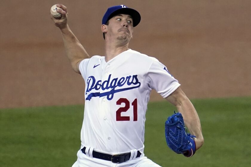 Los Angeles Dodgers starter Walker Buehler throws to an Oakland Athletics batter during the first inning.