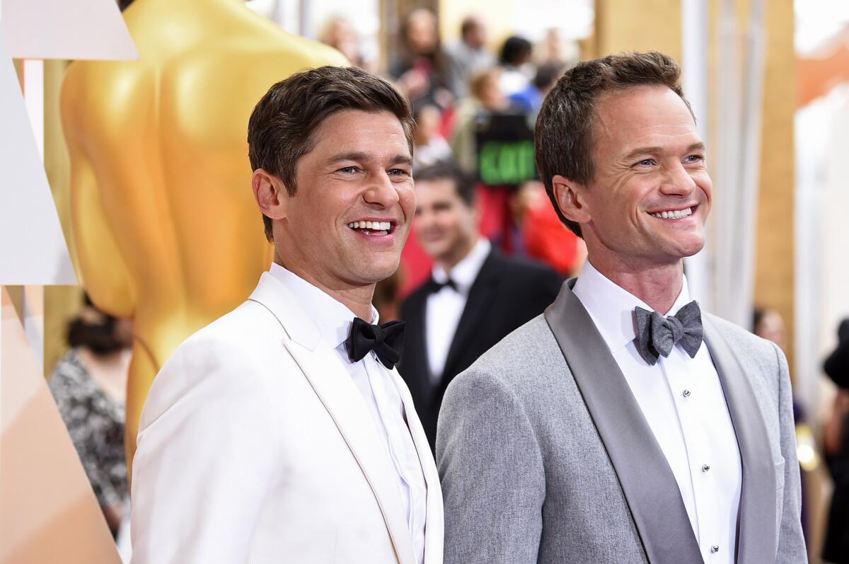 Host Neil Patrick Harris, right, and David Burtka at the Oscars.