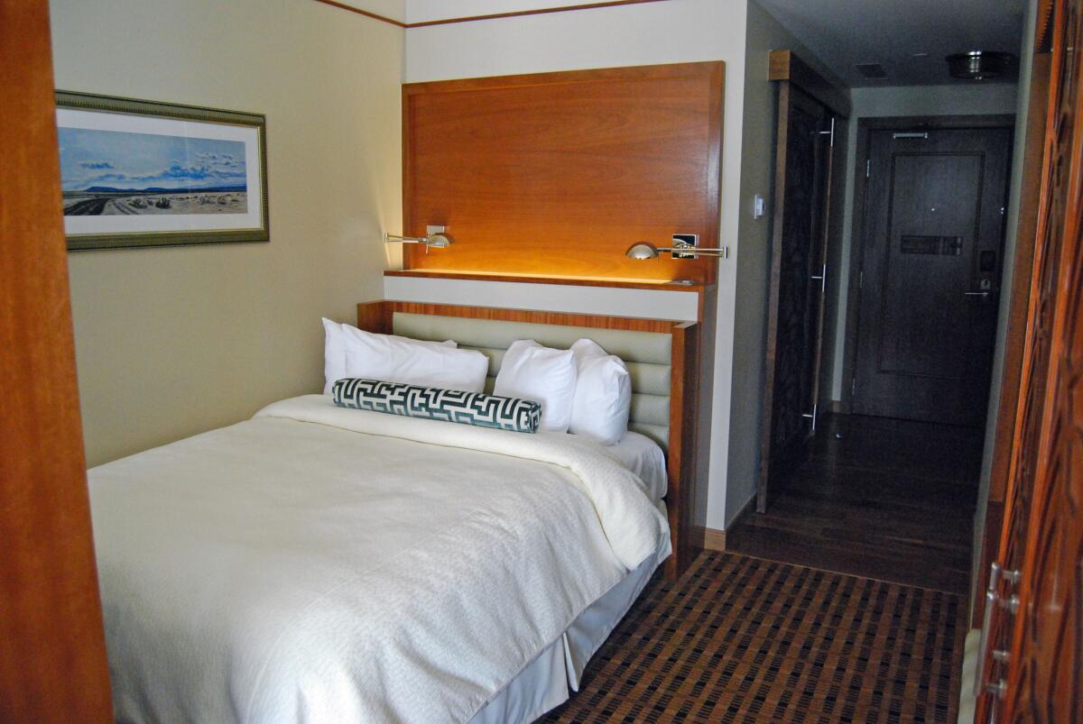 A Crawford Hotel pullman-style room emulates the luxury of sleeper travel style of another era.