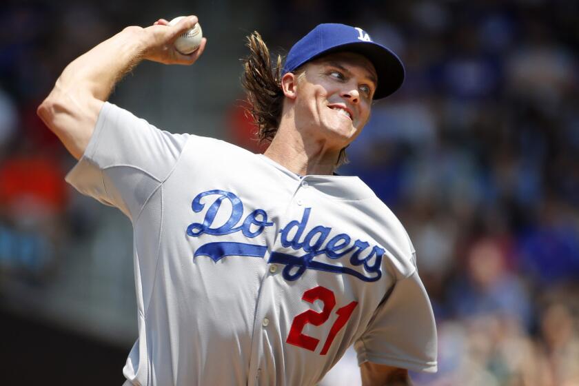 Dodgers starter Zack Greinke delivers a pitch during the first inning of Sunday's game against the New York Mets.