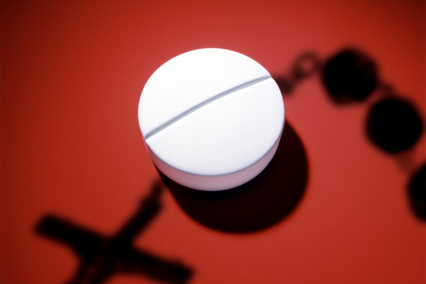 photo illustration of a white pill on a red surface with a shadow of rosary beads cast across the pill