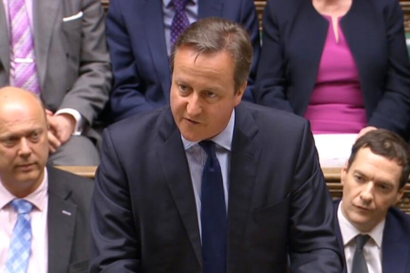 British Prime Minister David Cameron makes a statement to the House of Commons on April 11.