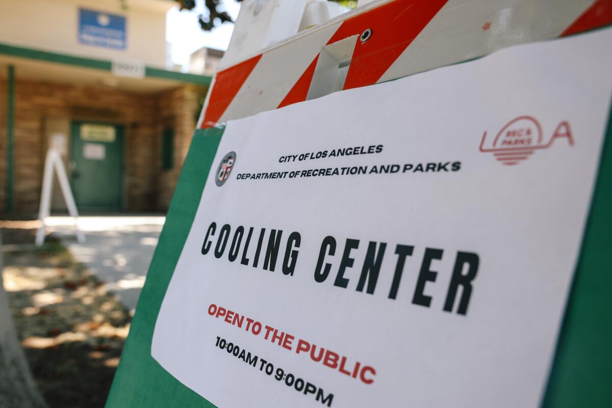 A sign directs people to a cooling center 