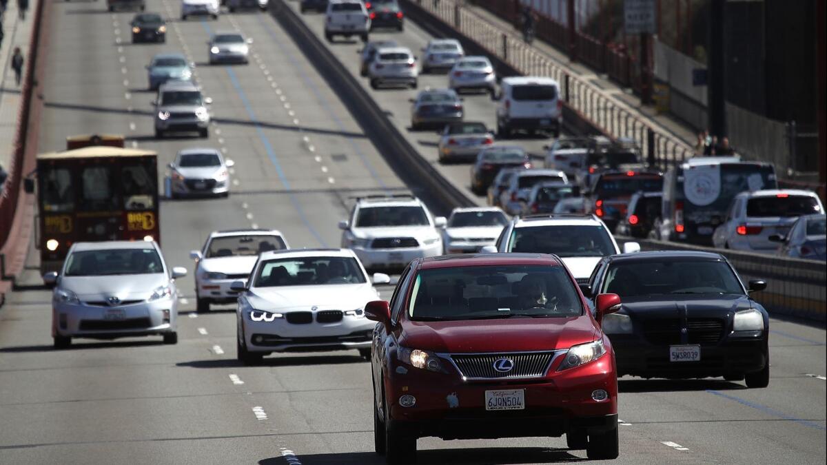 Cars drive over the Golden Gate Bridge in Sausalito.