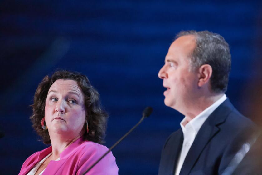 Los Angeles, CA - October 08: Rep. Katie Porter and Rep. Adam Schiff, left, and right participate in a debate on stage with other democrats who are running to succeed Sen. Feinstein at Westing Bonaventure Hotel on Sunday, Oct. 8, 2023 in Los Angeles, CA. (Dania Maxwell / Los Angeles Times)