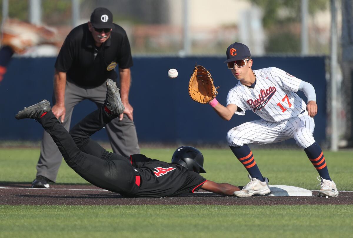 Pacifica Christian's Luke Miller (17) fields a throw against San Bernardino on Tuesday.