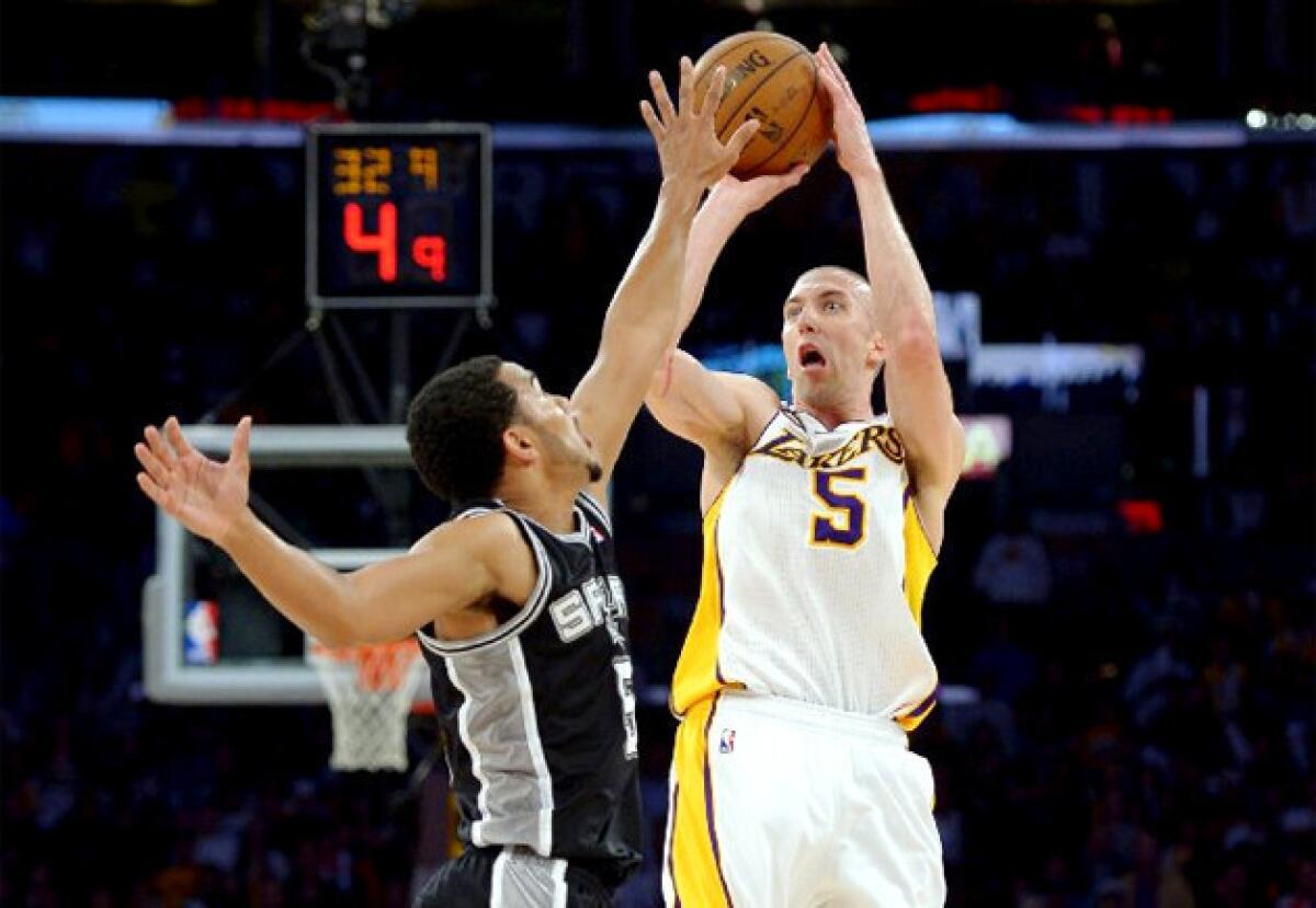 Lakers guard Steve Blake shoots over Spurs guard Cory Joseph during Sunday's game against San Antonio.