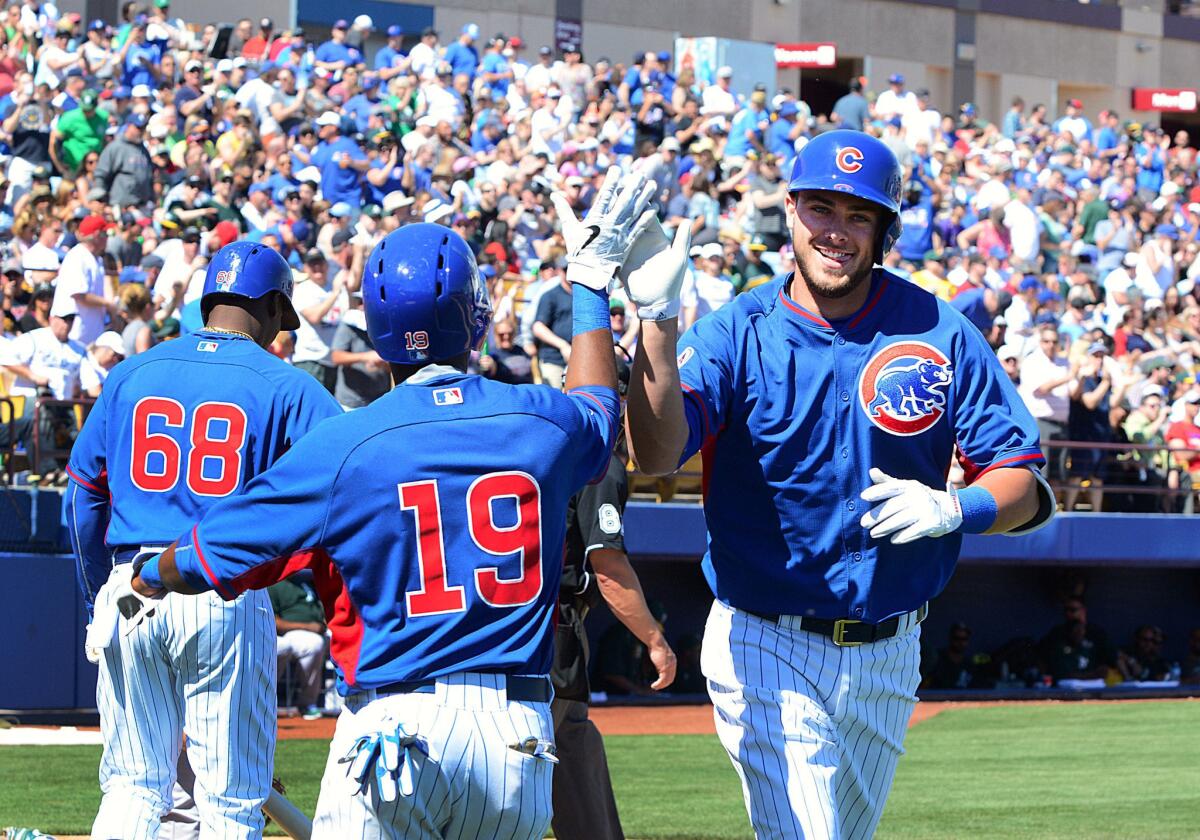 Kris Bryant is likely all smiles, as seen here, as he will make his major league debut with the Cubs after being promoted.