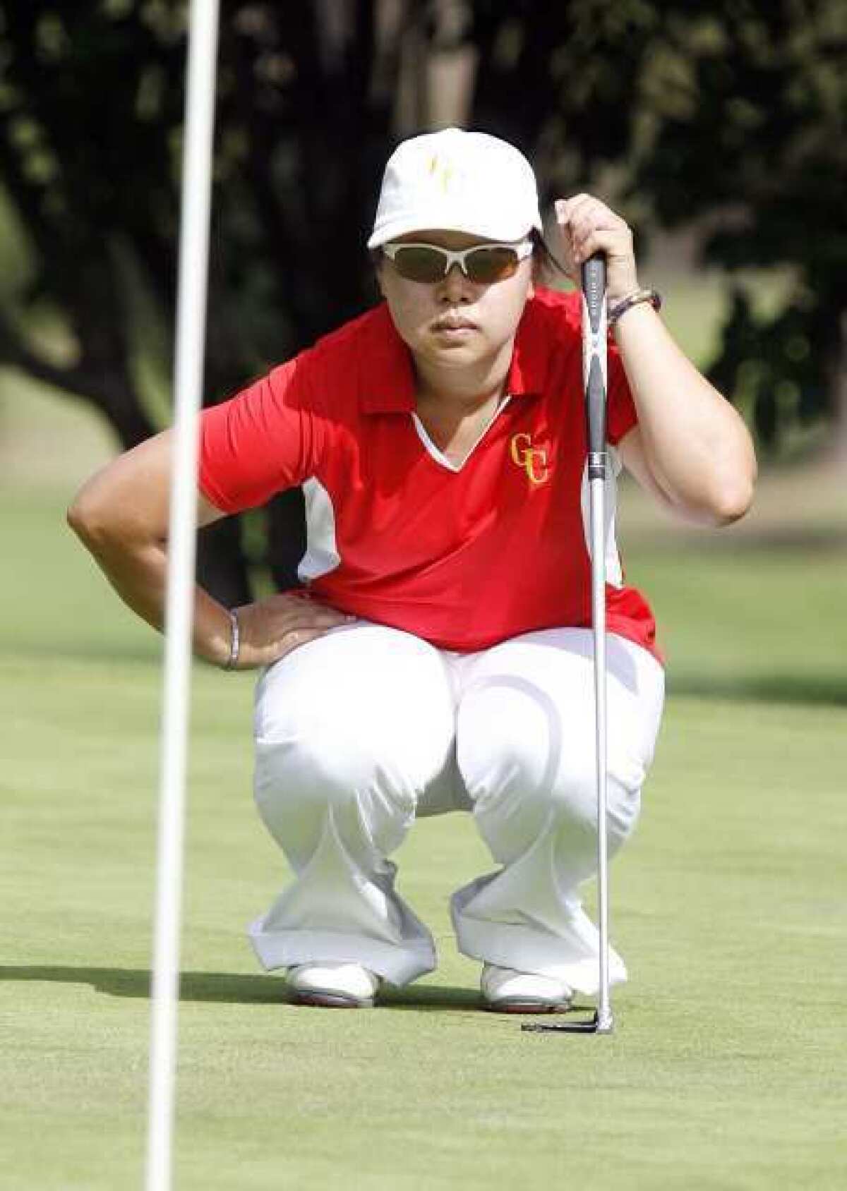 GCC's Pattraporn Silawanna eyes her putt on the fourth green at Brookside Golf Course in Pasadena.