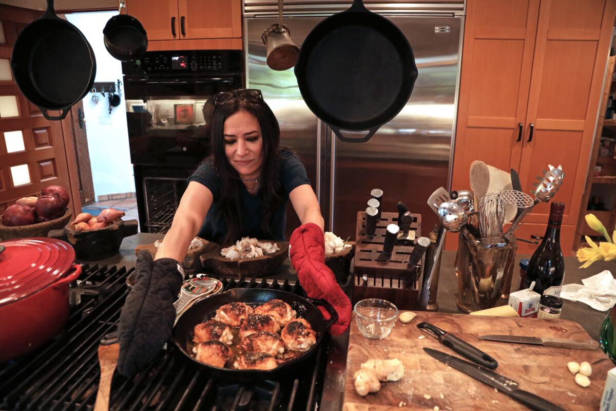 Pamela Adlon sets out a skillet of chicken at her home, which is in many ways a model for her character's in "Better Things."
