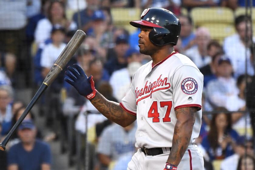 LOS ANGELES, CALIFORNIA OCTOBER 3, 2019-Nationals Howie Kendrick tosses his bat after striking out against the Dodgers in the 1st inning in Game 1 of the NLDS at Dodger Stadium Thursday. (Wally Skalij/Los Angeles Times)