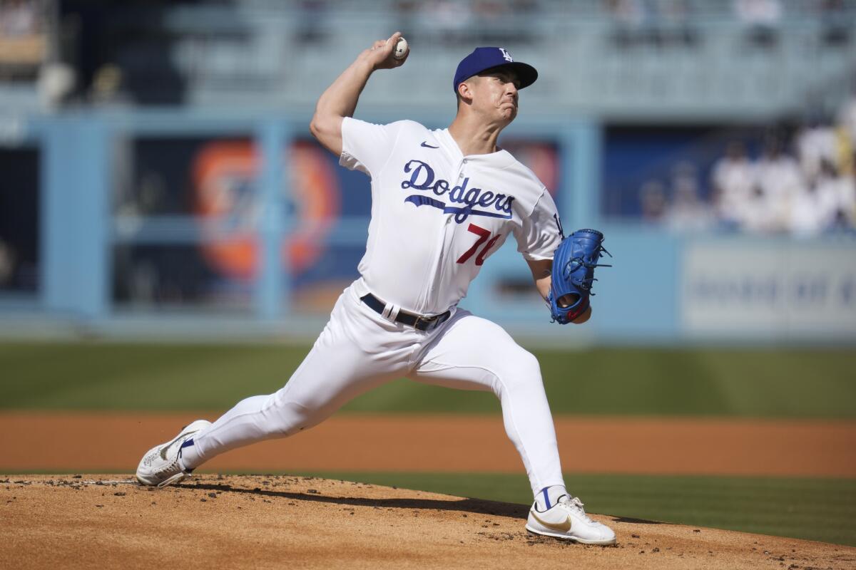 Los Angeles Dodgers starting pitcher Bobby Miller throws during the first inning.