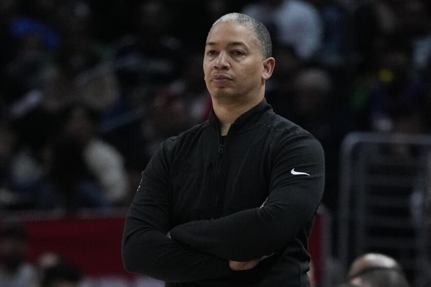 Los Angeles Clippers head coach Tyronn Lue watches the second half of an NBA basketball game.