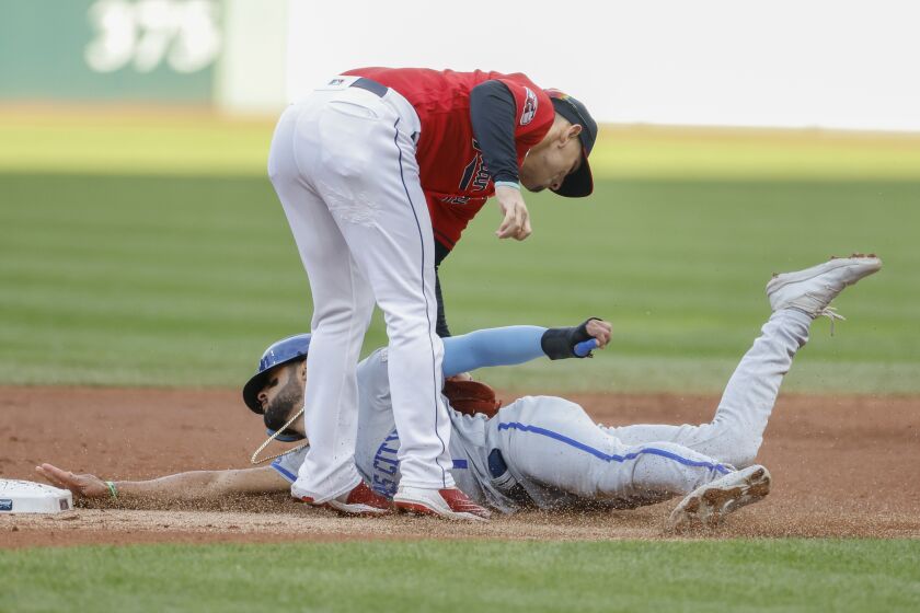 Cleveland Guardians second baseman Andres Gimenez tags out Kansas City Royals' MJ Melendez attempting to steal second base during the first inning of a baseball game, Monday, Oct. 3, 2022, in Cleveland. (AP Photo/Ron Schwane)