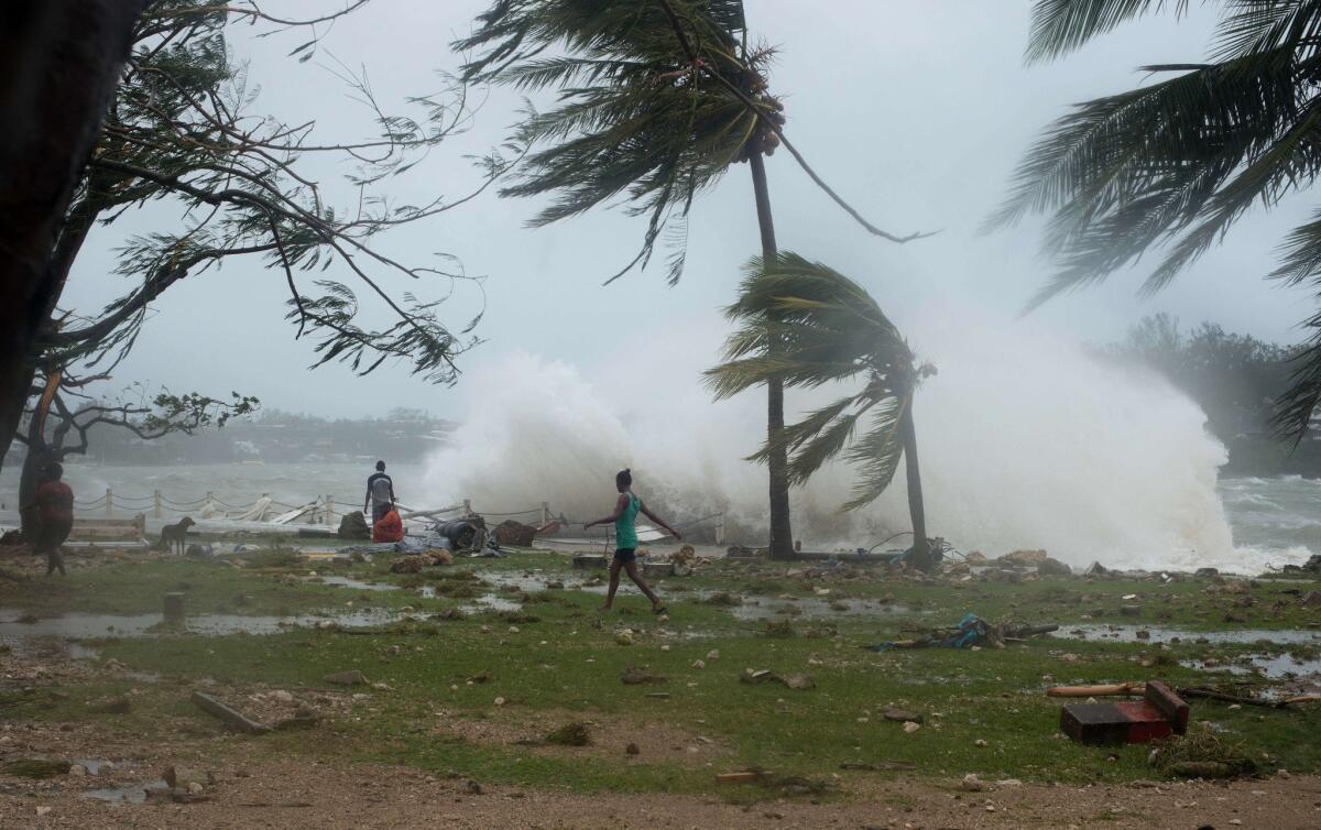 Debris caused by Cyclone Pam is scattered along the coast in the Vanuatu capital of Port Vila.