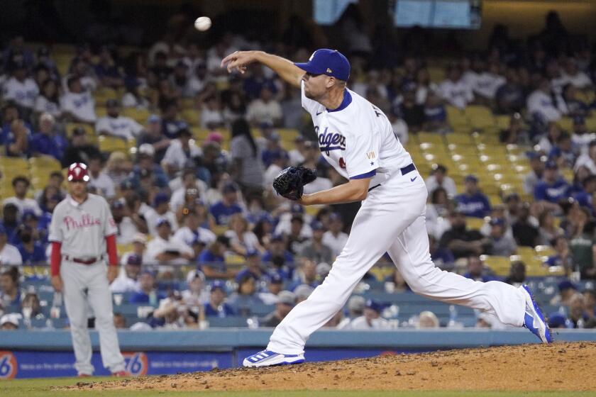 Los Angeles Dodgers relief pitcher Blake Treinen throws to the plate during the ninth inning of a baseball game against the Philadelphia Phillies Tuesday, June 15, 2021, in Los Angeles. (AP Photo/Mark J. Terrill)