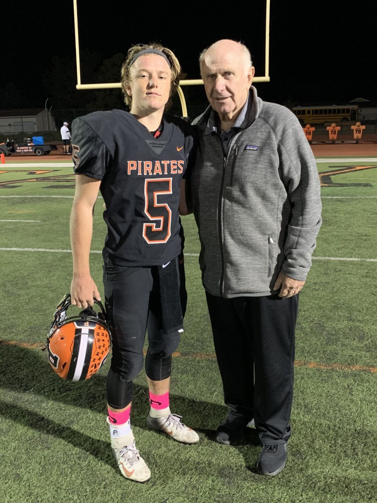 Santa Ynez quarterback Bennett Redell with his grandfather, former Oaks Christian coach Bill Redell.