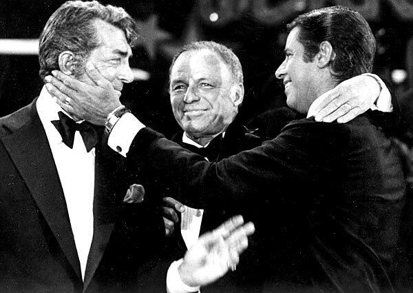 Singers Dean Martin, Frank Sinatra and Jerry Lewis perform during the 1976 telecast of "The Jerry Lewis MDA Telethon" in Los Angeles.