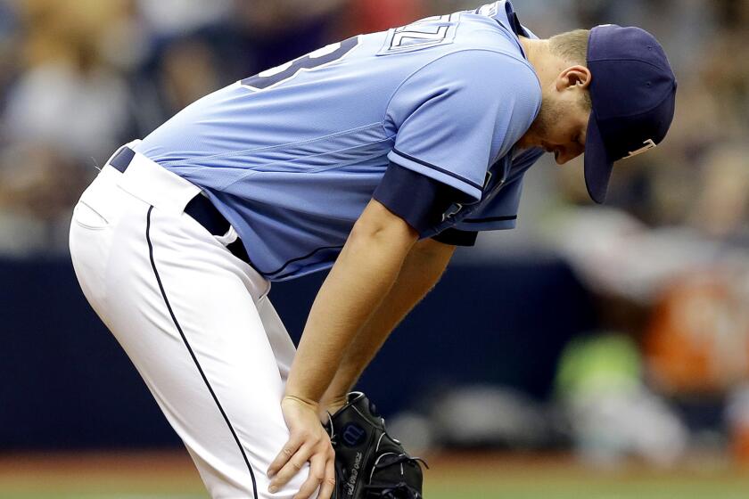 Rays starter Jake Odorizzi reacts after giving up a two-run home run to the Yankees' Starlin Castro during the seventh inning Sunday.