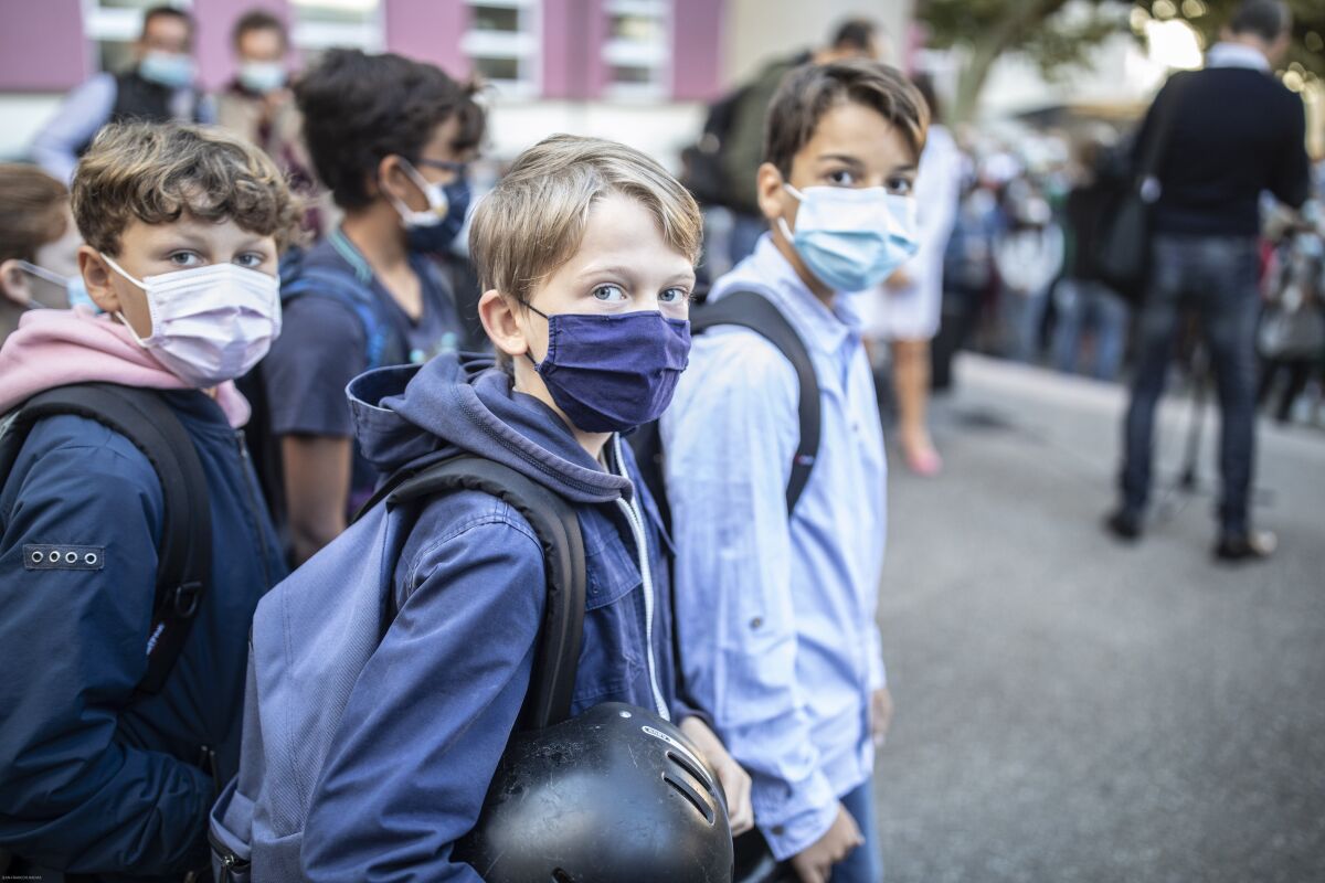 Children return to school in Strasbourg, eastern France, Thursday Sept. 2, 2021. France’s virus situation has slightly improved in recent weeks, with about 17,000 confirmed cases of infection each day on average, down from more than 23,000 around mid-August. But many fear a reverse of the trend now that children are back to school. (AP Photo/Jean-François Badias)