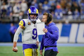 Rams quarterback Matthew Stafford (9) talks with head coach Sean McVay.