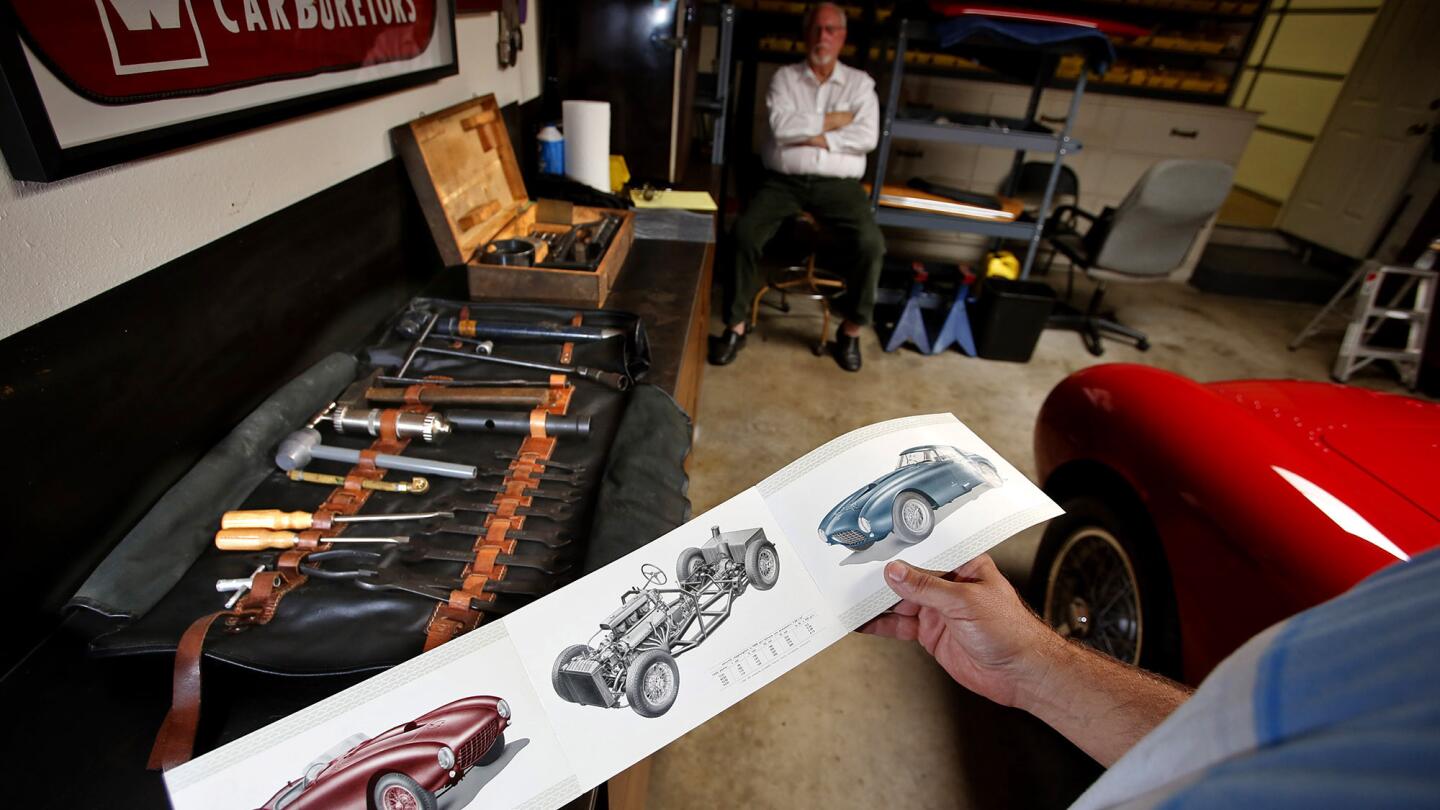 Charles Betz's son Brooke, holding the original tri-fold brochure that came with the car, estimated his dad and Fred Peters, background, put $400,000 into the Ferrari's engine alone, and at least $1 million in other parts.