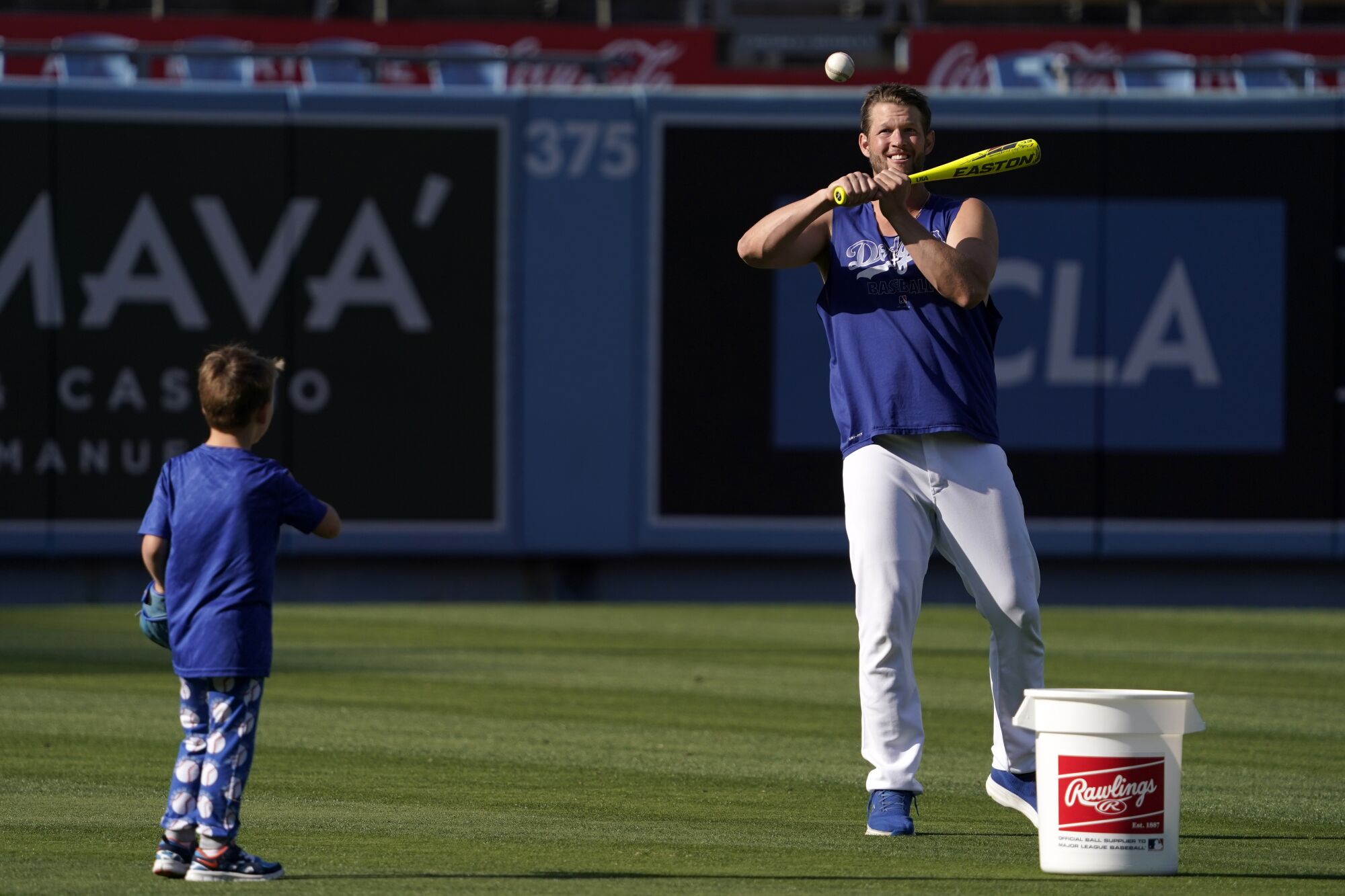 The Dodgers' Clayton Kershaw and his son Charley, 5, play ball May 17, 2022.
