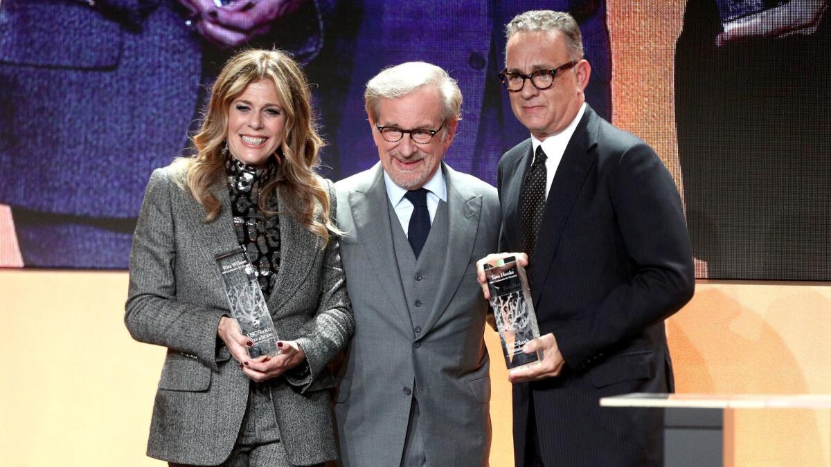 USC Shoah Foundation founder Steven Spielberg, center, with honorees Rita Wilson, left, and Tom Hanks at the Monday gala at the Beverly Hilton, which raised nearly $4 million to fund the organization's programs.