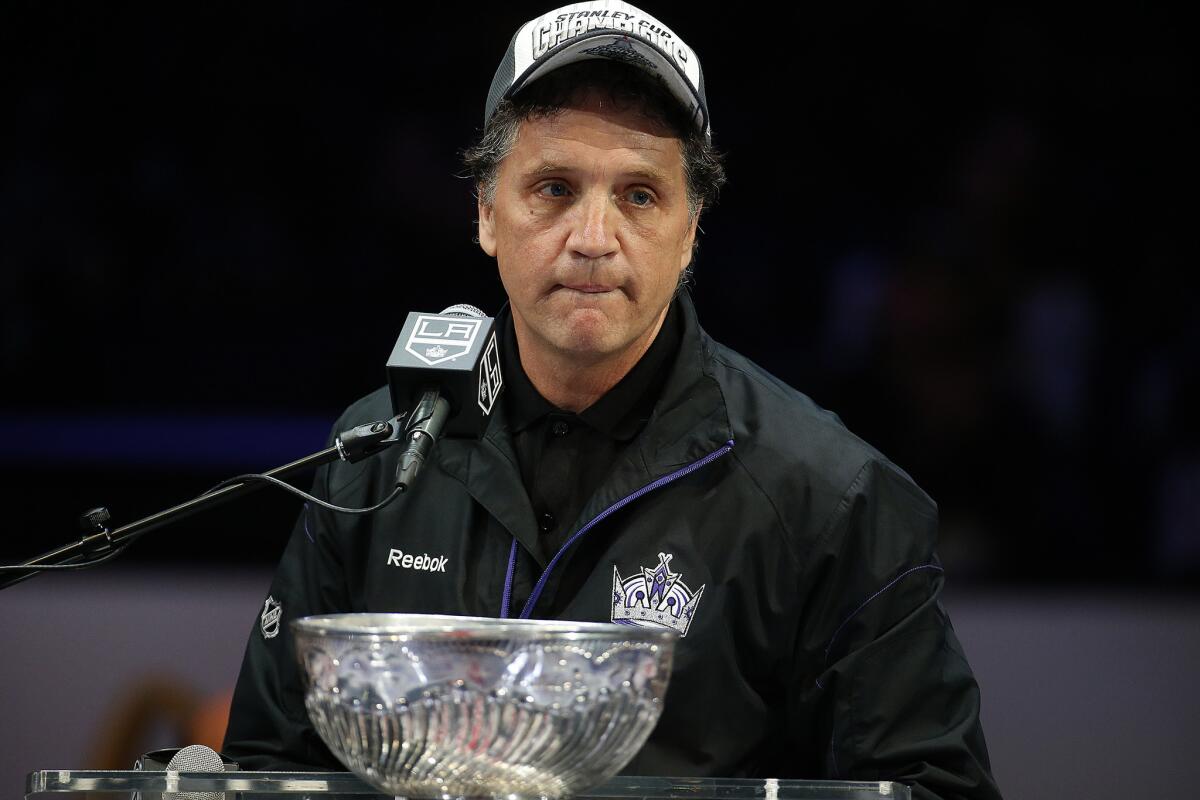 Kings General Manager Dean Lombardi fights tears as he talks about the Kings players during a rally at Staples Center in June.