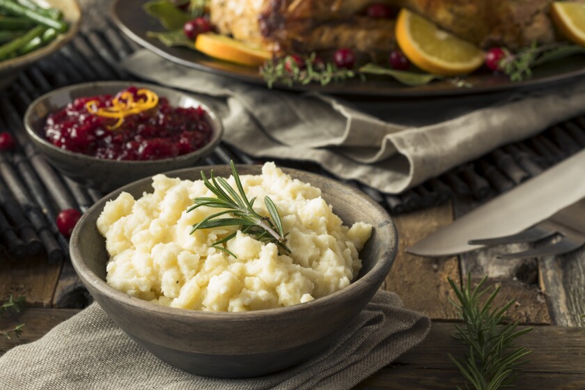 Homemade Thanksgiving Mashed Potatoes with butter and Rosemary