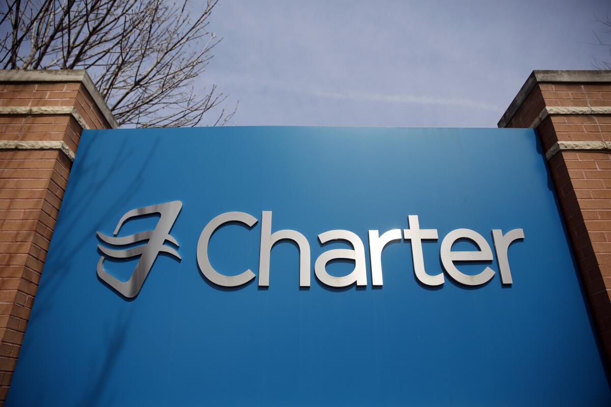 Signage at an entrance to Charter Communications' headquarters in Town and Country, Mo.