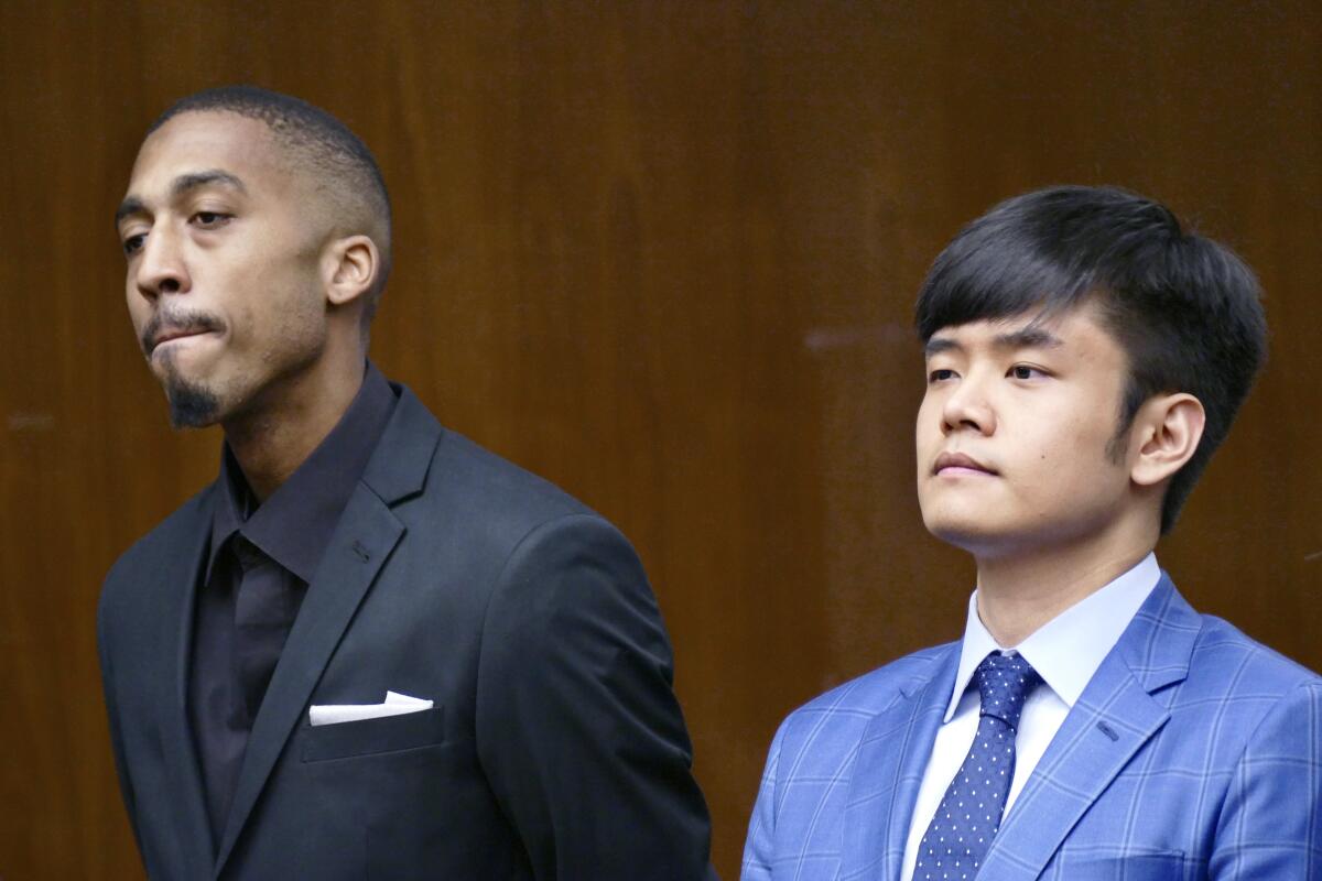 Darryl Hicks, left, and Tung Ming appear in court in Torrance in 2017.