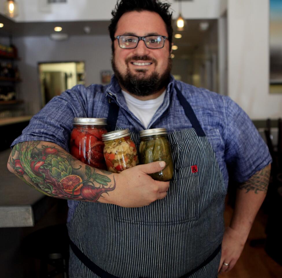Bruce Kalman, chef and proprietor at Union in Pasadena, holds up blood oranges, giardiniera and pickles. Pickle plates started popping up right around the time "gastropub" entered our culinary vocabulary, but some restaurants are taking their brine-submerged vegetables to new heights.