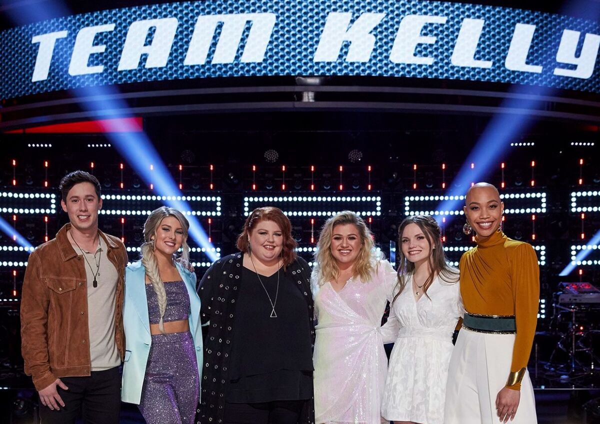 Cedrice, far right, ended up on "The Voice" team of Kelly Clarkson, third from right, who has invited the La Mesa singer to join her on the stage in Las Vegas.