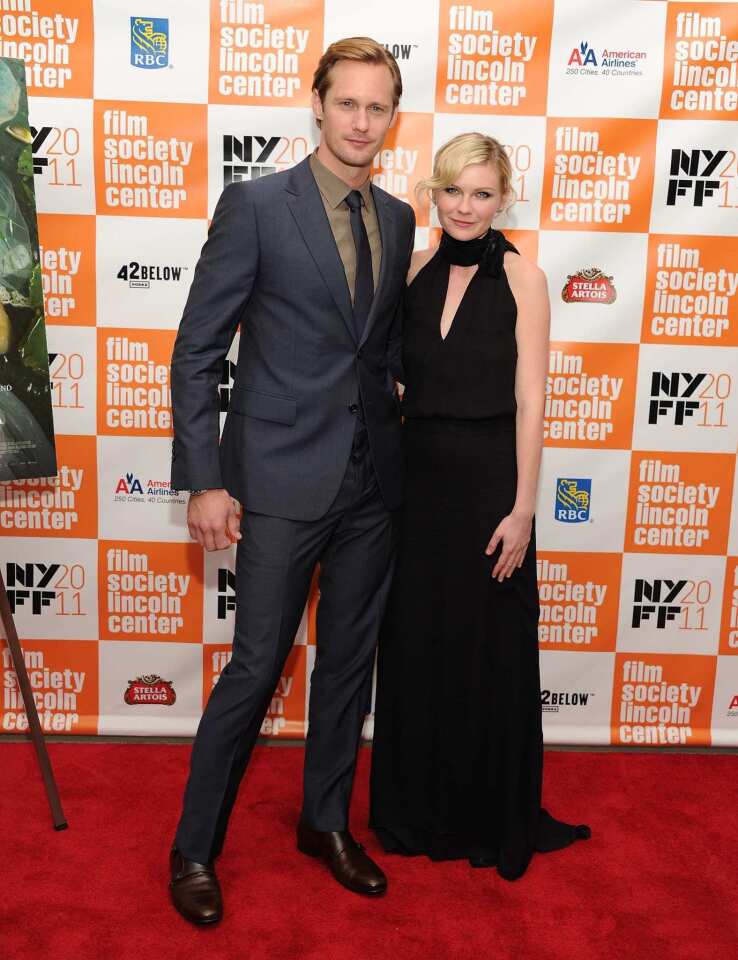 Onscreen husband and wife Alexander Skarsgaard and Kirsten Dunst celebrated the opening of their new movie "Melancholia" at the New York Film Festival on Monday. The Lars von Trier-directed sci-fi drama follows two sisters played by Dunst and Charlotte Gainsbourg as another planet threatens to collide with Earth.