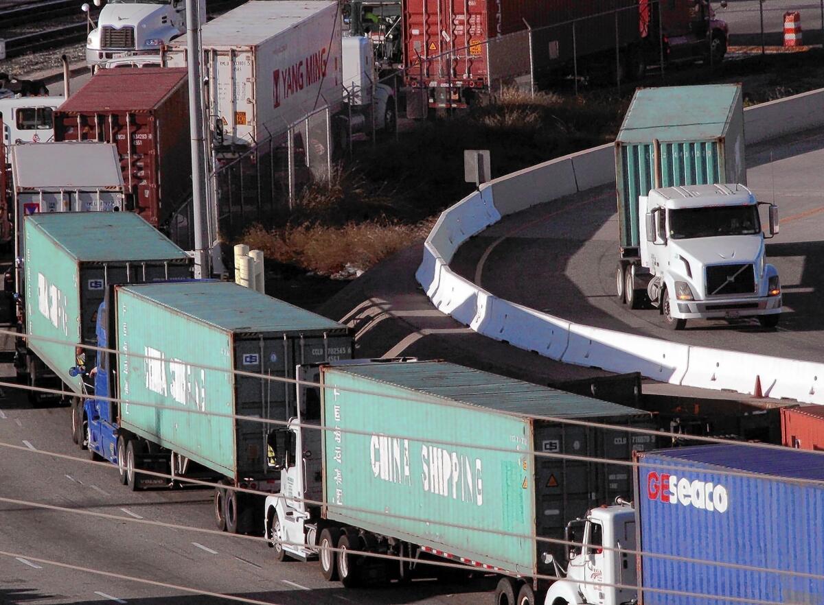 Trucks line up to get to loading areas in San Pedro. The Air Resources Board will give small fleets, lightly used trucks and those operating in rural areas more time to upgrade to newer, cleaner models or install filters to remove soot from their exhaust.