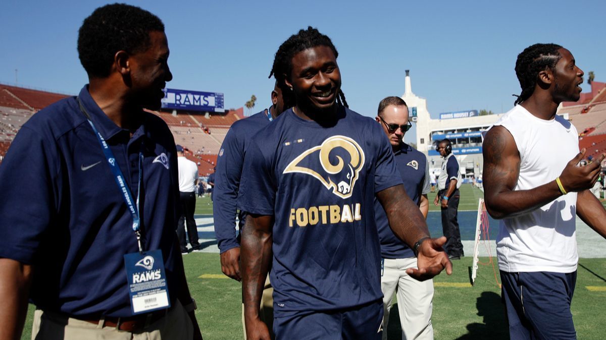 Newly acquired Rams wide receiver Sammy Watkins, center, walks with a team official before the Rams play the Dallas Cowboys in a preseason game on Aug. 12.