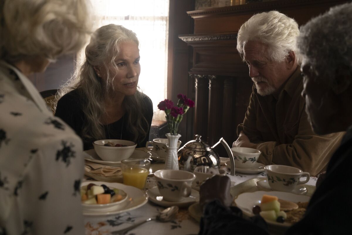 Barbara Hershey's character and other nursing home residents confer over a meal in "The Manor."