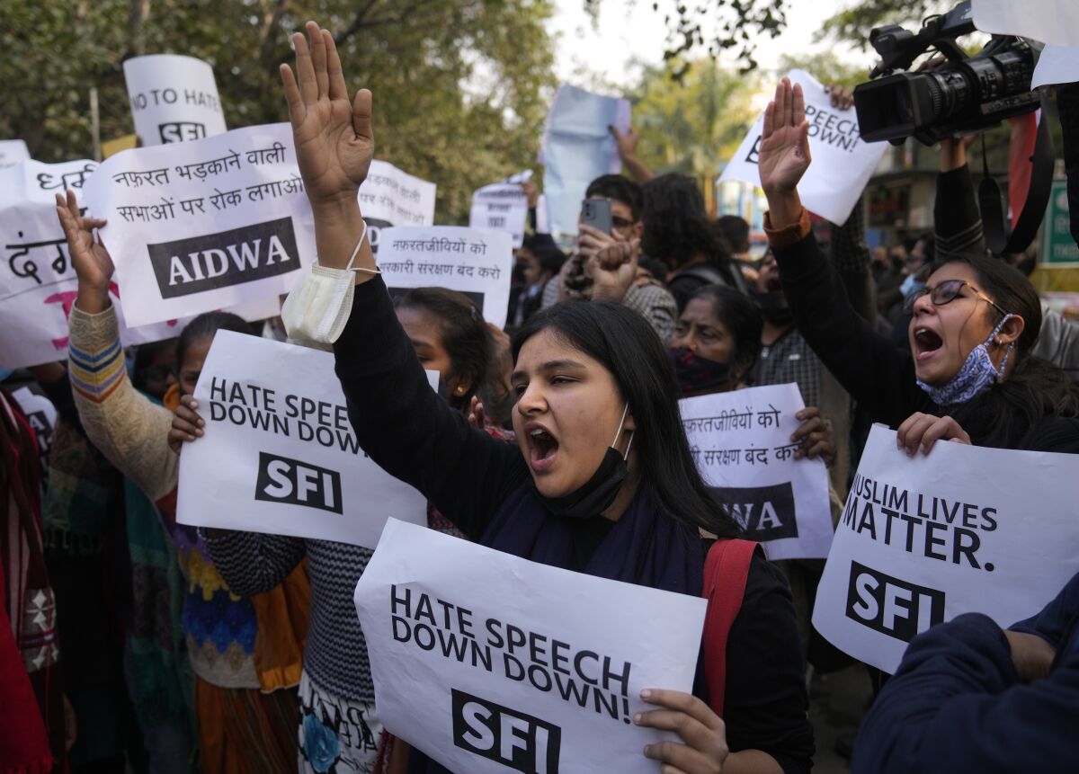 FILE- Activists of various left organizations shout slogans during a protest against hate speech in New Delhi, India, Dec.27, 2021. Indian police have opened a case and begun investigating a Hindu monk for making highly provocative speeches against Muslims and organizing a closed-door meeting that called for their genocide, officials said Monday. (AP Photo/Manish Swarup, File)