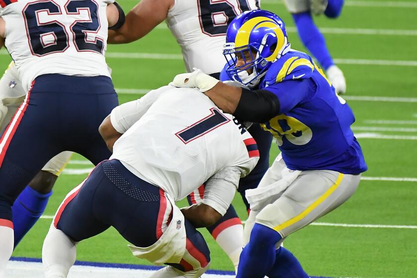 Rams defensive lineman Aaron Donald sacks Patriots quarterback Cam Newton in the 2nd quarter at SoFi Stadium Thursday.