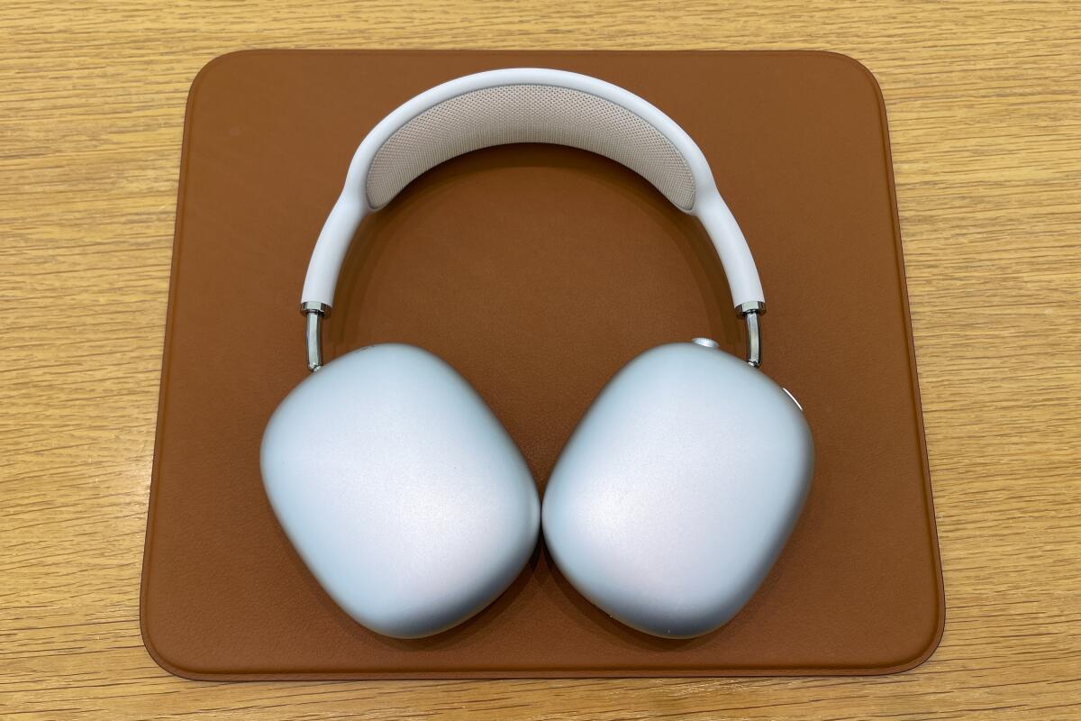 A pair of AirPods Max headphones on a table