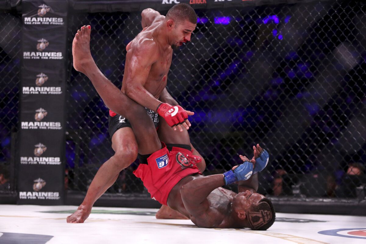 Douglas Lima, top, goes on the offensive agianst Lorenz Larkin during their welterweight title fight at Bellator NYC.