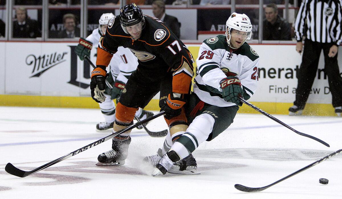 Ducks center Ryan Kesler (17) tangles with Wild right wing Jason Pominville during the first period Friday night.